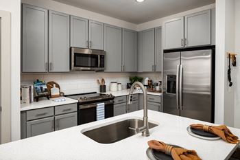 Quartz countertops in kitchen & bathrooms